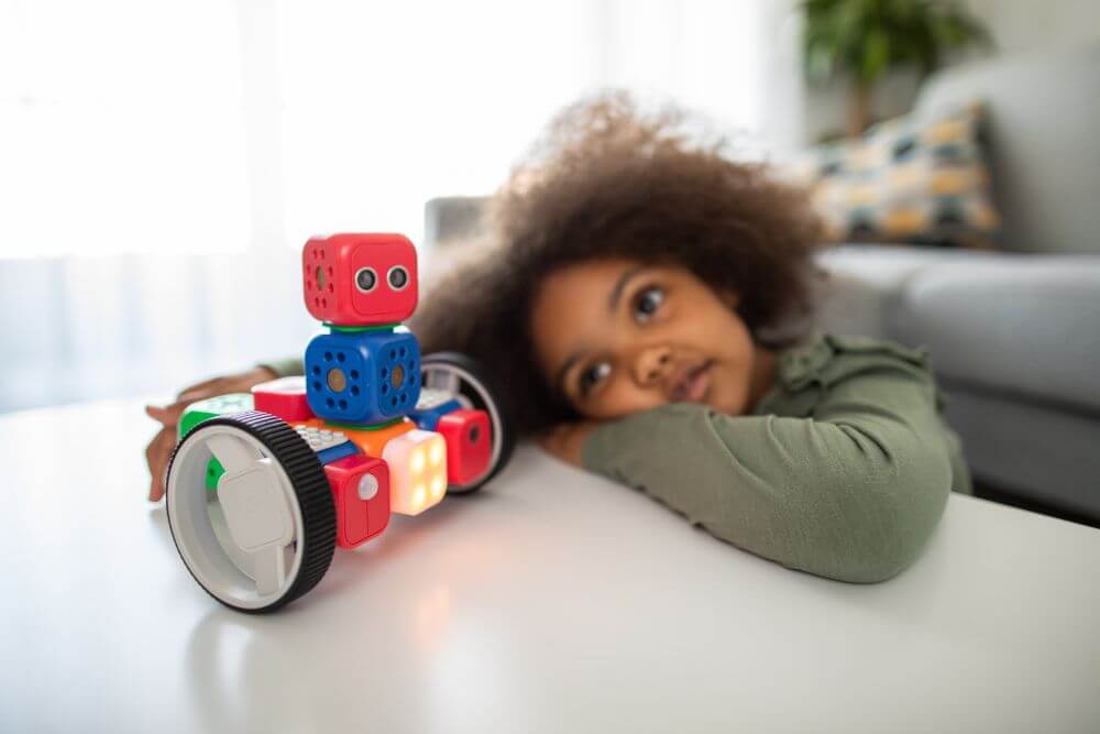 child playing with robot symbolizing how to help a child with autism